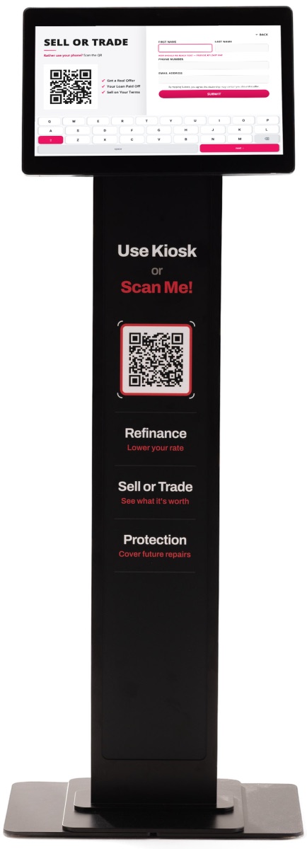 The kiosk showing its Sell or Trade form with a QR code on screen, above the stand's Use Kiosk or Scan Me banner and its own QR code.